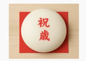 白い丸餅に赤い「祝一歳」の文字が入った一升餅が、赤い敷き紙と木製の台に載っている写真風の画像。子どもの1歳の誕生日を祝う伝統行事としての一升餅の説明が下部に記載されている